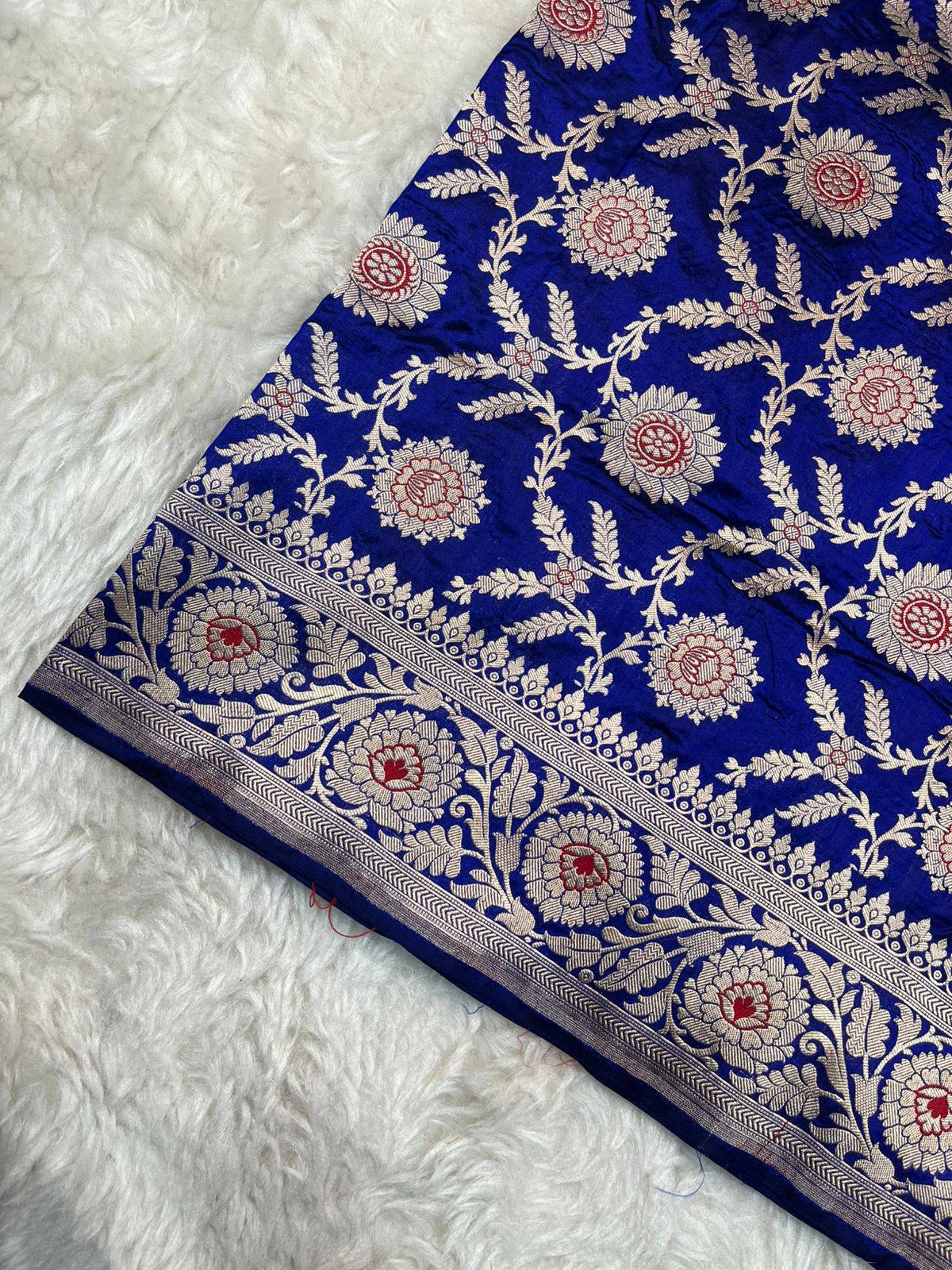 Cobalt Blue Pure Katan Silk Banarasi Saree – Gold Zari Floral Vines with Rust Orange and White Meenakari Marigold Motifs