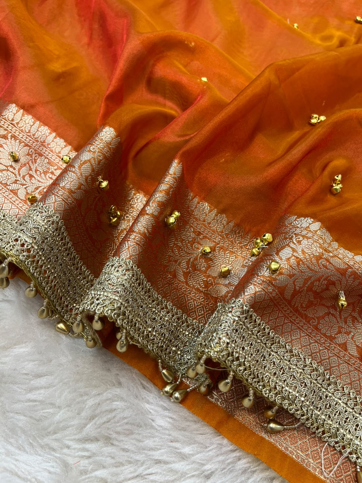 Fanta Orange Tissue Silk Saree Embellished with Ghungroo Motifs & Floral Brocade Pallu